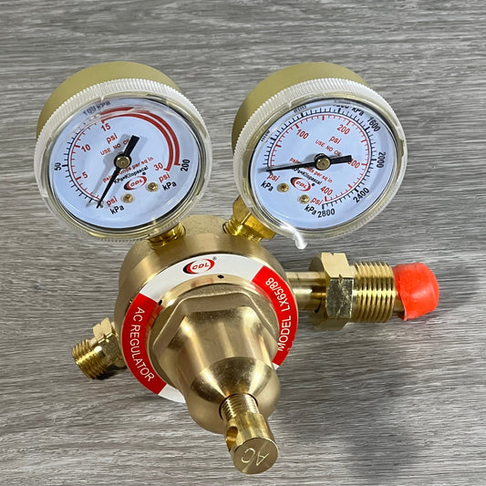 Acetylene regulator LX65/88 with dual gauges and CGA510 connection on a wooden surface.