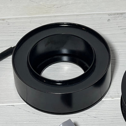 AC Compressor Clutch component from uxcell for Mazda 3, 2010-2013, shown on a light wooden surface.