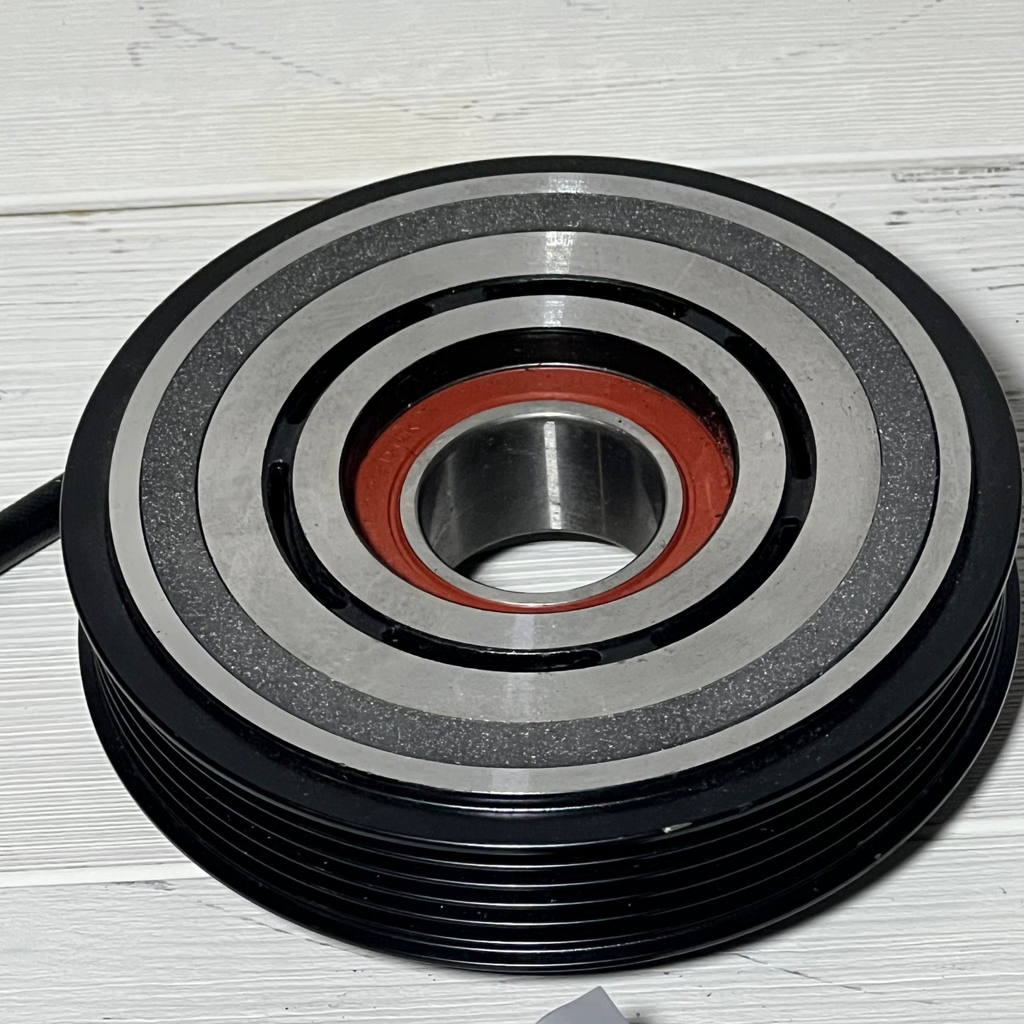 AC compressor clutch set for Mazda 3 2010-2013, detailed view of metal design and bearings.
