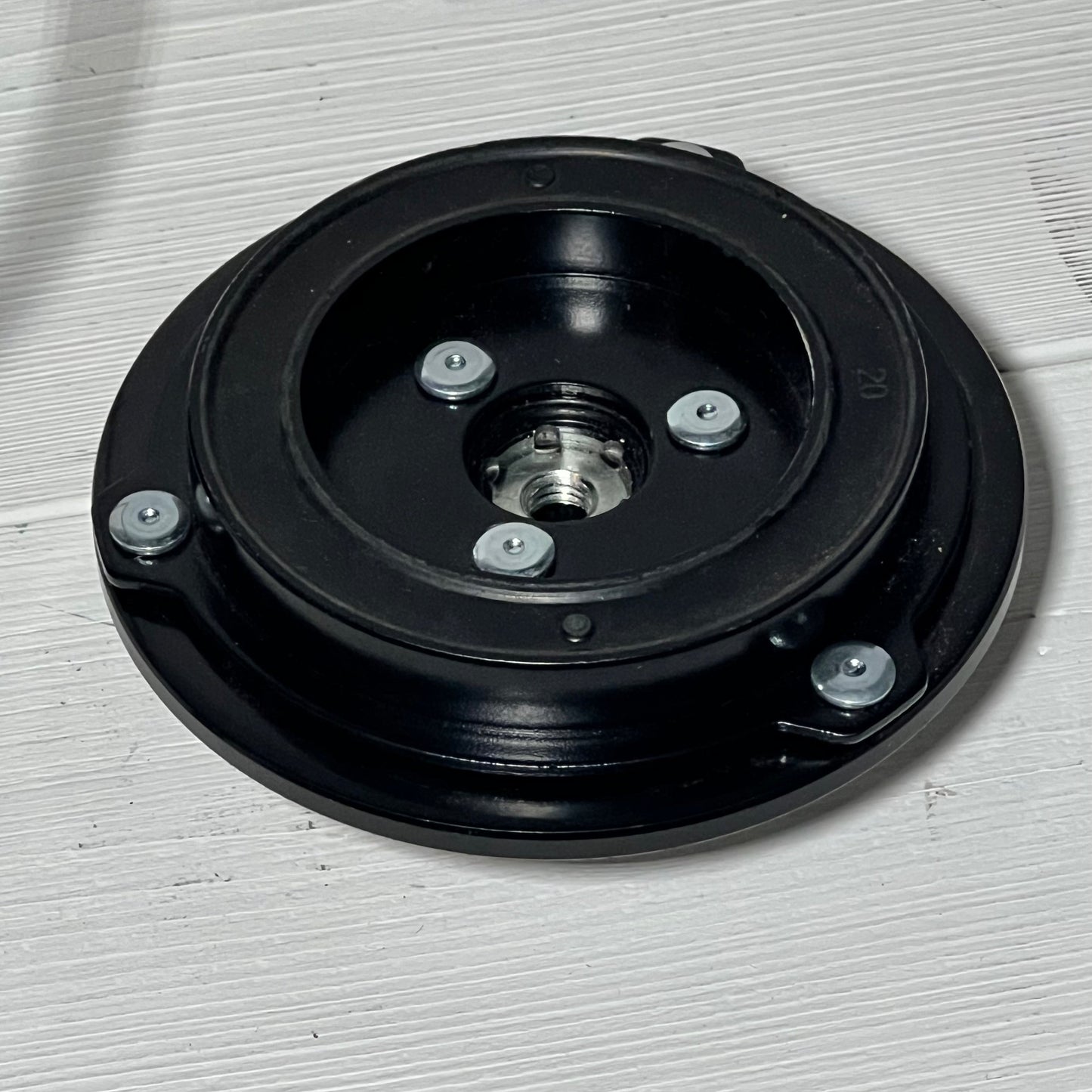 AC compressor clutch set for Mazda 3, 2010-2013, featuring durable black metal construction with bolt details.