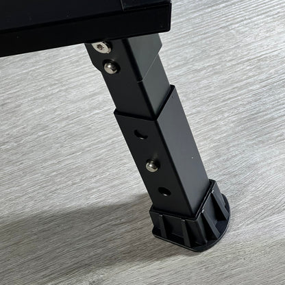 Adjustable black aluminum leg of DEPSUNNY RV step with non-slip rubber foot on wooden floor.