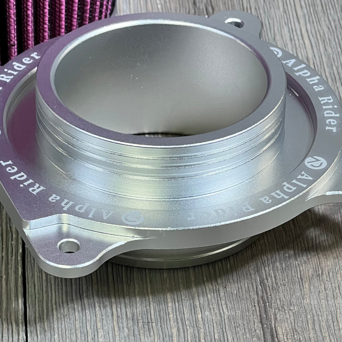 Silver intake holder adapter for 2006-2021 Yamaha YFM700 Raptor engine air filter kit, enhancing performance.