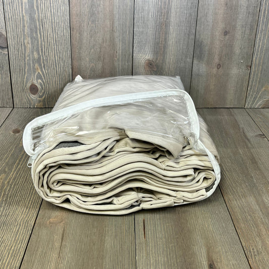 Beige velvet curtains folded in clear packaging, showcasing luxury blackout design for bedroom or living room.
