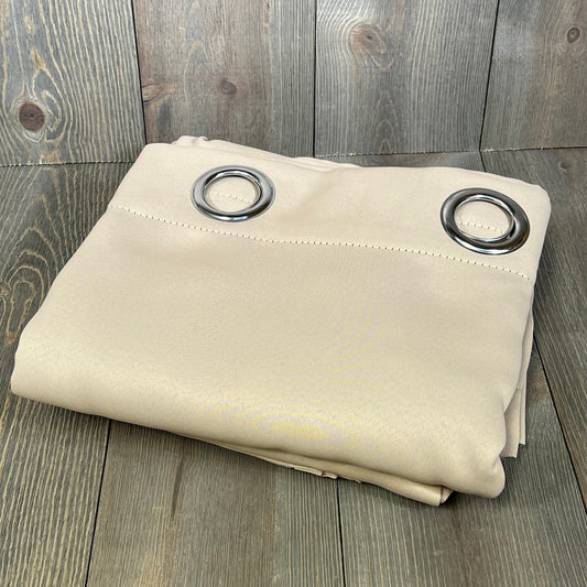 Beige ChrisDowa blackout curtains with grommets, folded on a wooden surface, 63-inch length, thermal insulated.
