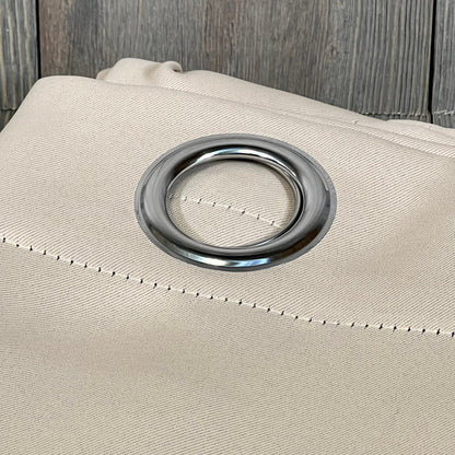 Beige ChrisDowa blackout curtain with silver grommet, showcasing thick fabric for bedroom light blocking.