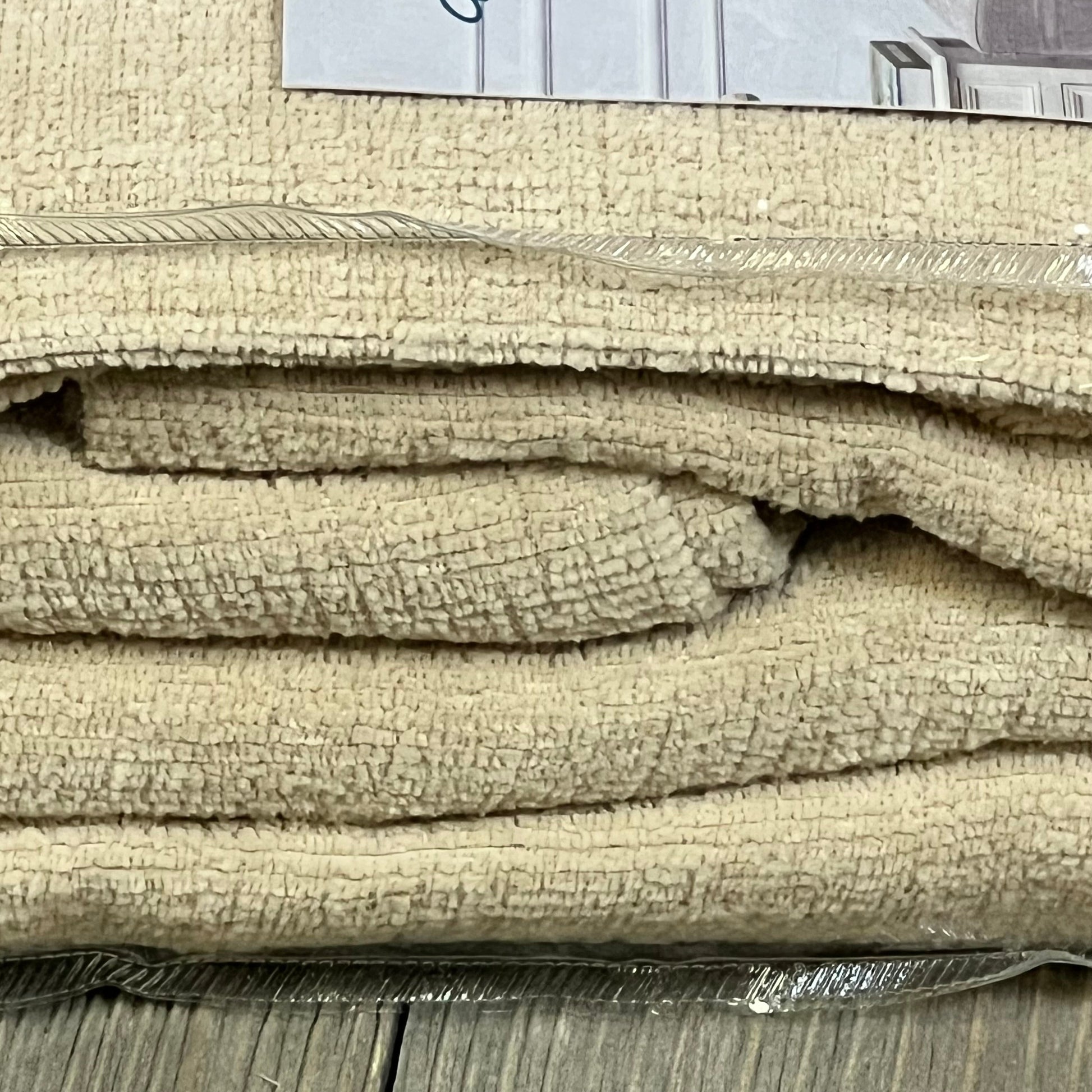 Beige chenille throw pillow covers in packaging, showcasing soft texture for farmhouse decor in living room or bedroom.