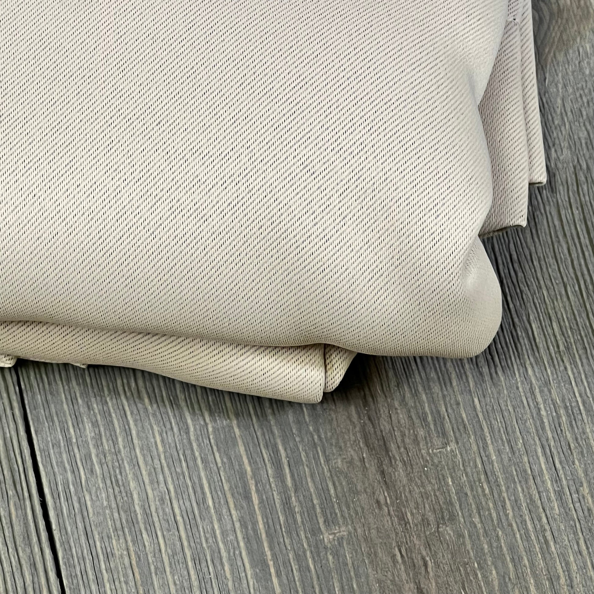 Beige ChrisDowa blackout curtains folded, highlighting thick, thermal-insulated fabric texture for bedroom windows.