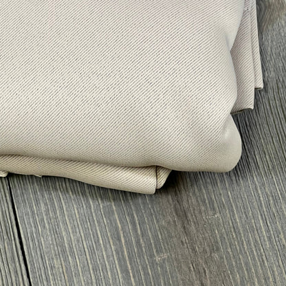 Beige ChrisDowa blackout curtains folded, highlighting thick, thermal-insulated fabric texture for bedroom windows.