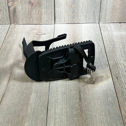 Black Kelecuia toe cage pedal adapter for Peloton bike, featuring adjustable straps for secure sneaker fit on wooden floor.