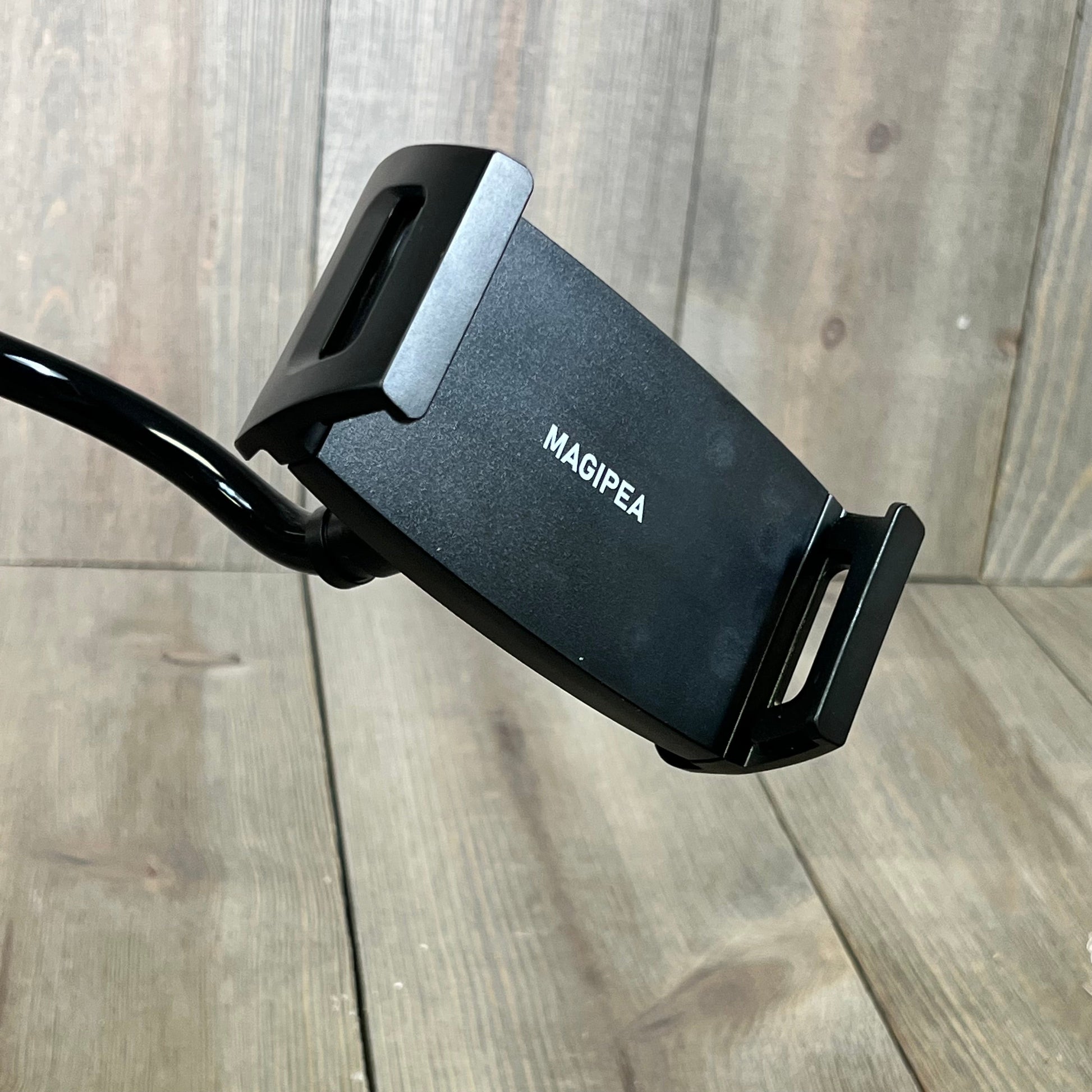 Black tablet stand holder with a flexible gooseneck, compatible with iPad, iPhone, and Samsung Galaxy tablets.