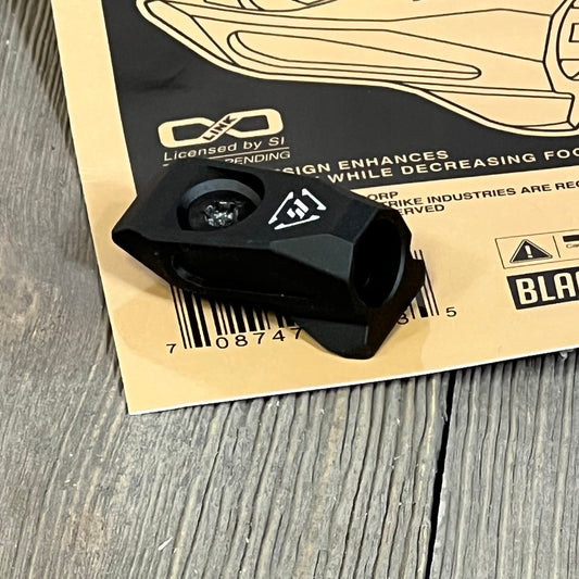 Black Strike Link Angled QD Mount on wooden surface, showcasing durable design and compact size.