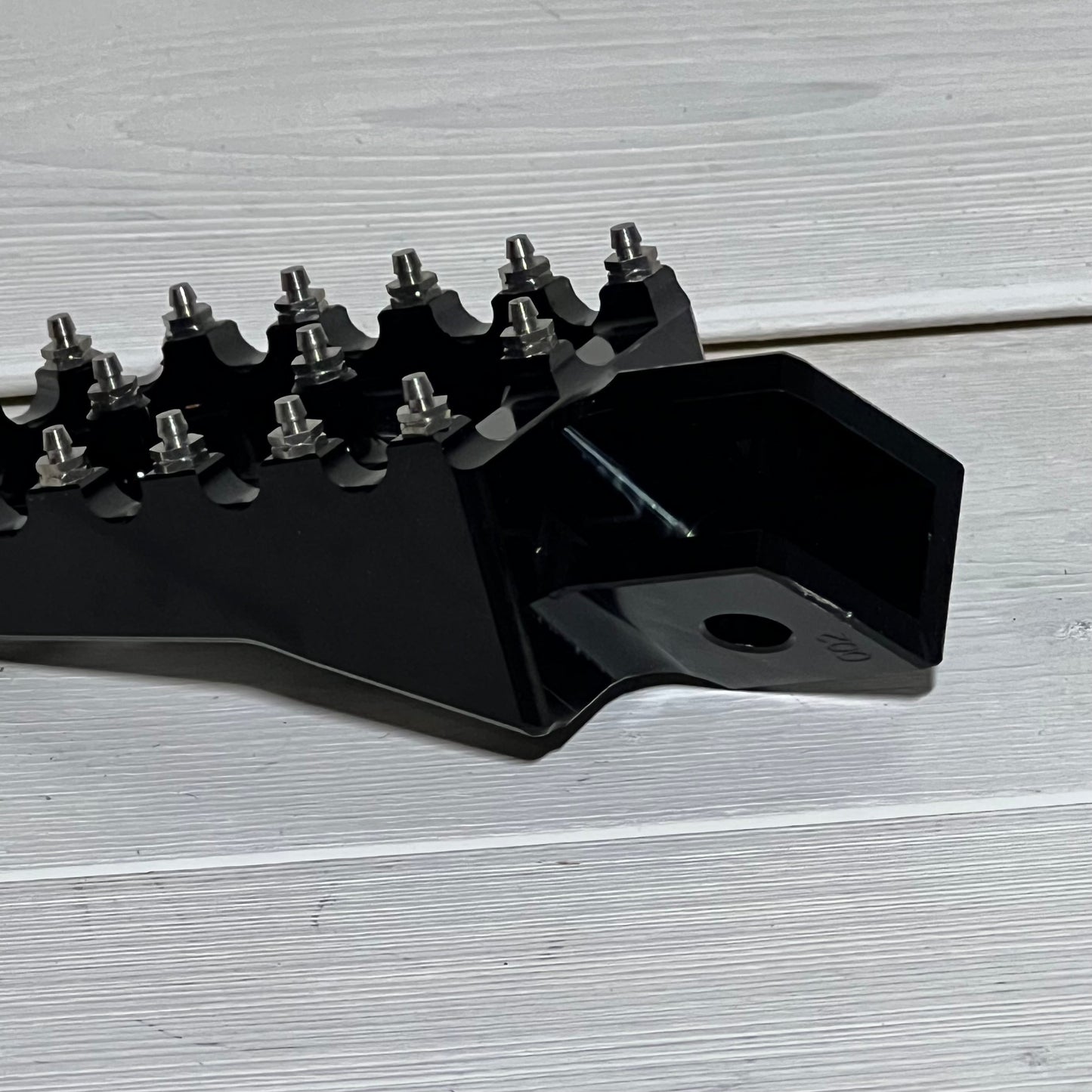 Black AnXin motorcycle foot peg for PW50, PW80, pit dirt bikes, showcasing durable metal construction and sleek design.
