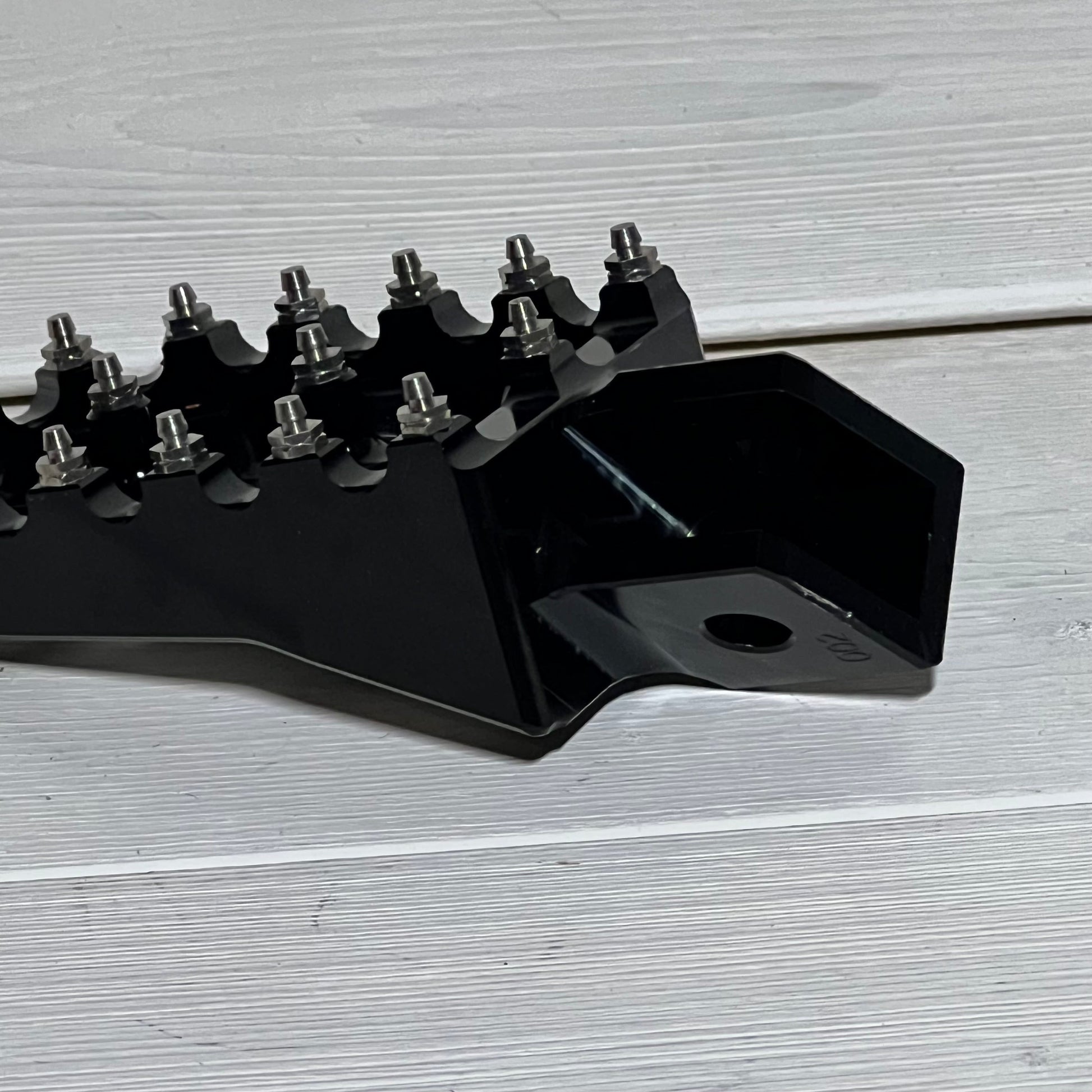 Black AnXin motorcycle foot peg for PW50, PW80, pit dirt bikes, showcasing durable metal construction and sleek design.