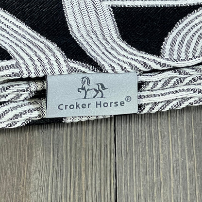 Croker Horse luxury pillow cover with black embroidery, featuring a detailed horse and horseshoe pattern on a modern design.