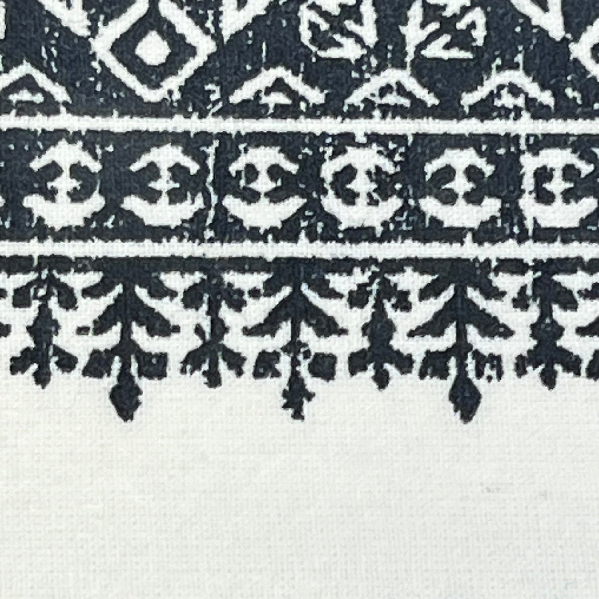 Boho design detail on navy and white tufted chenille curtain, showcasing intricate pattern for stylish window treatment.