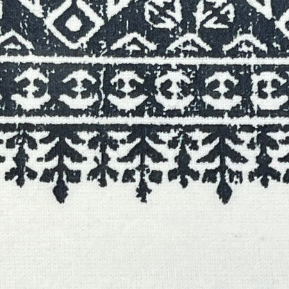 Boho design detail on navy and white tufted chenille curtain, showcasing intricate pattern for stylish window treatment.