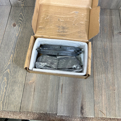 ECCPP rear ceramic disc brake pads kit in open box for Chevrolet Silverado and Suburban models.