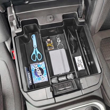 Center console organizer for Chevy Silverado/GMC Sierra, featuring compartments for accessories, shown installed in armrest.