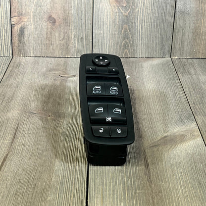 Master power window switch for Chrysler, Dodge, Ram models, featuring dual auto controls and lock functions.