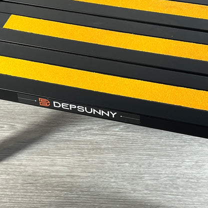 Black DEPSUNNY RV step with bright yellow non-slip strips on aluminum platform.