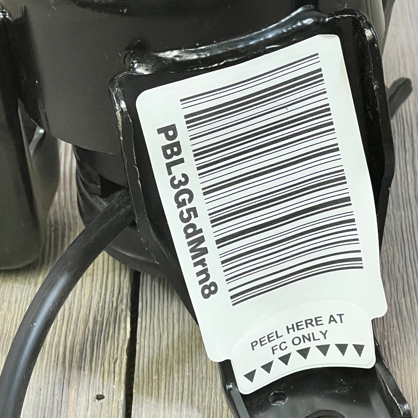Close-up of TRQ rear engine mount with barcode, compatible with Infiniti JX35, QX60, Nissan Murano, Pathfinder, Quest.