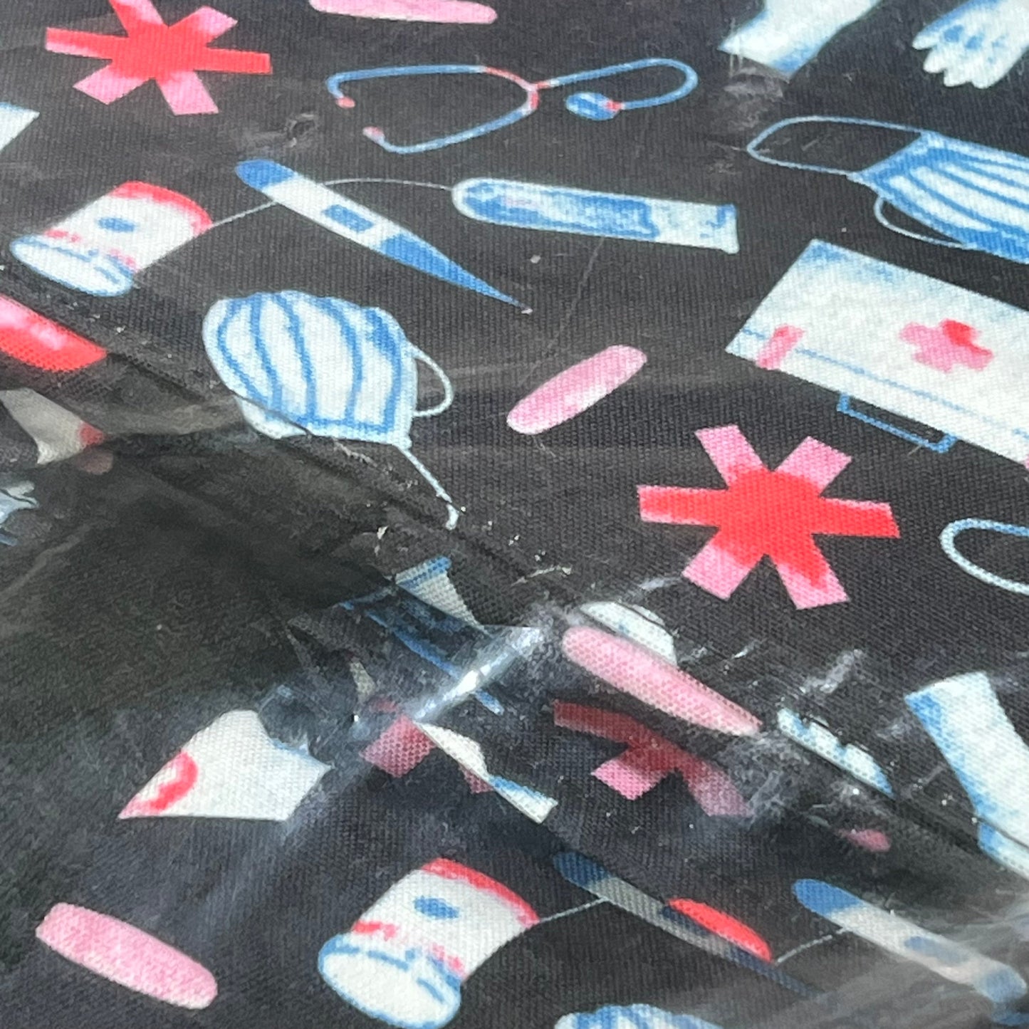 Nurse-themed pattern with medical icons on waterproof fabric of ABAMERICA nursing bag, ideal for students and professionals.