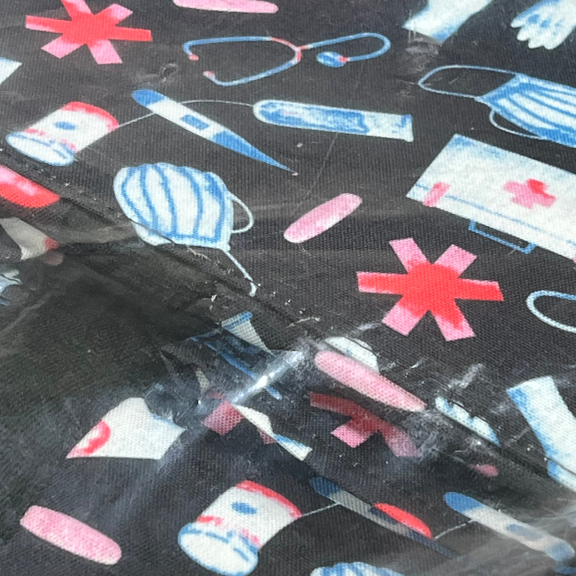 Nurse-themed pattern with medical icons on waterproof fabric of ABAMERICA nursing bag, ideal for students and professionals.