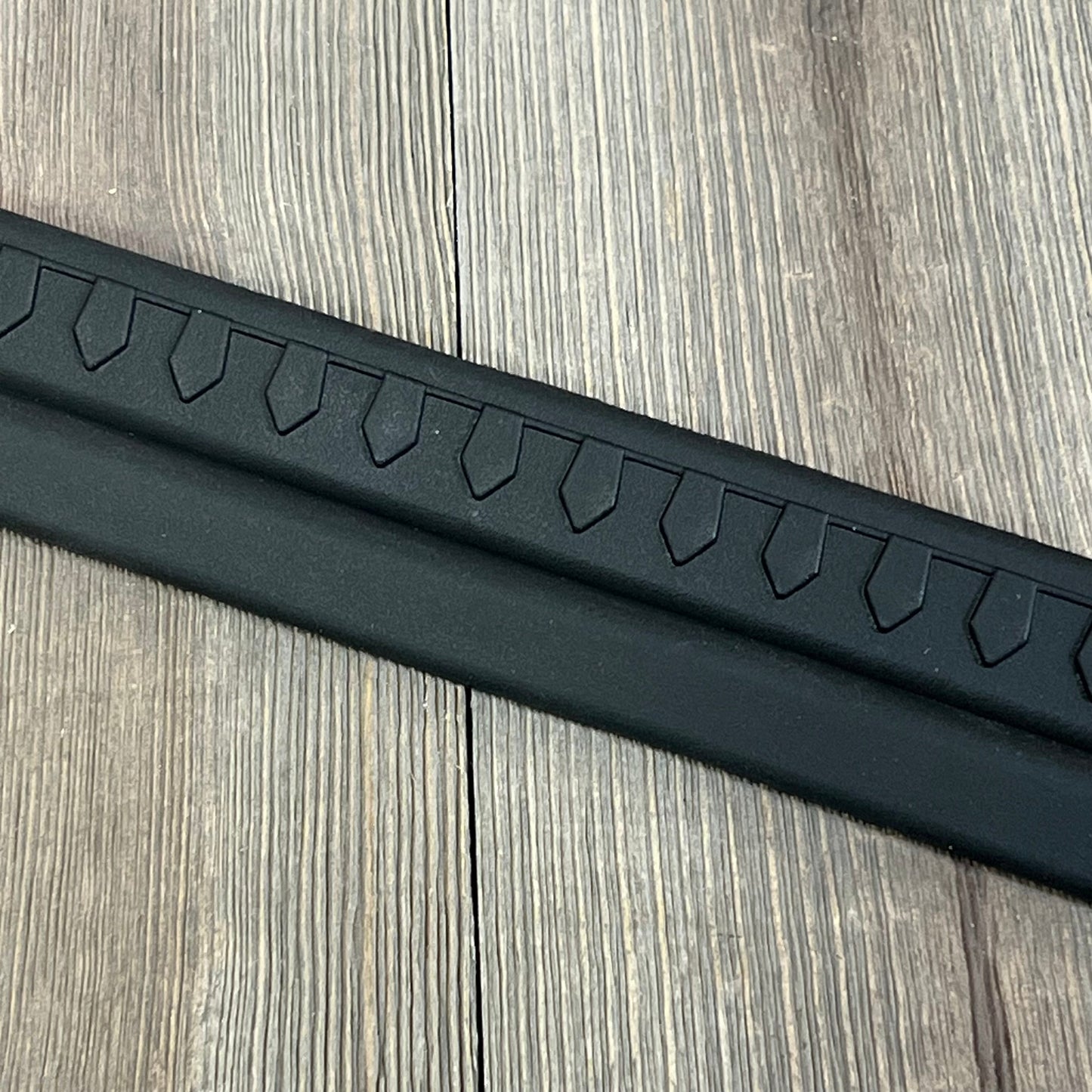 Black thermoplastic entry guard for Jeep Wrangler TJ/LJ, featuring a rugged, all-terrain design.
