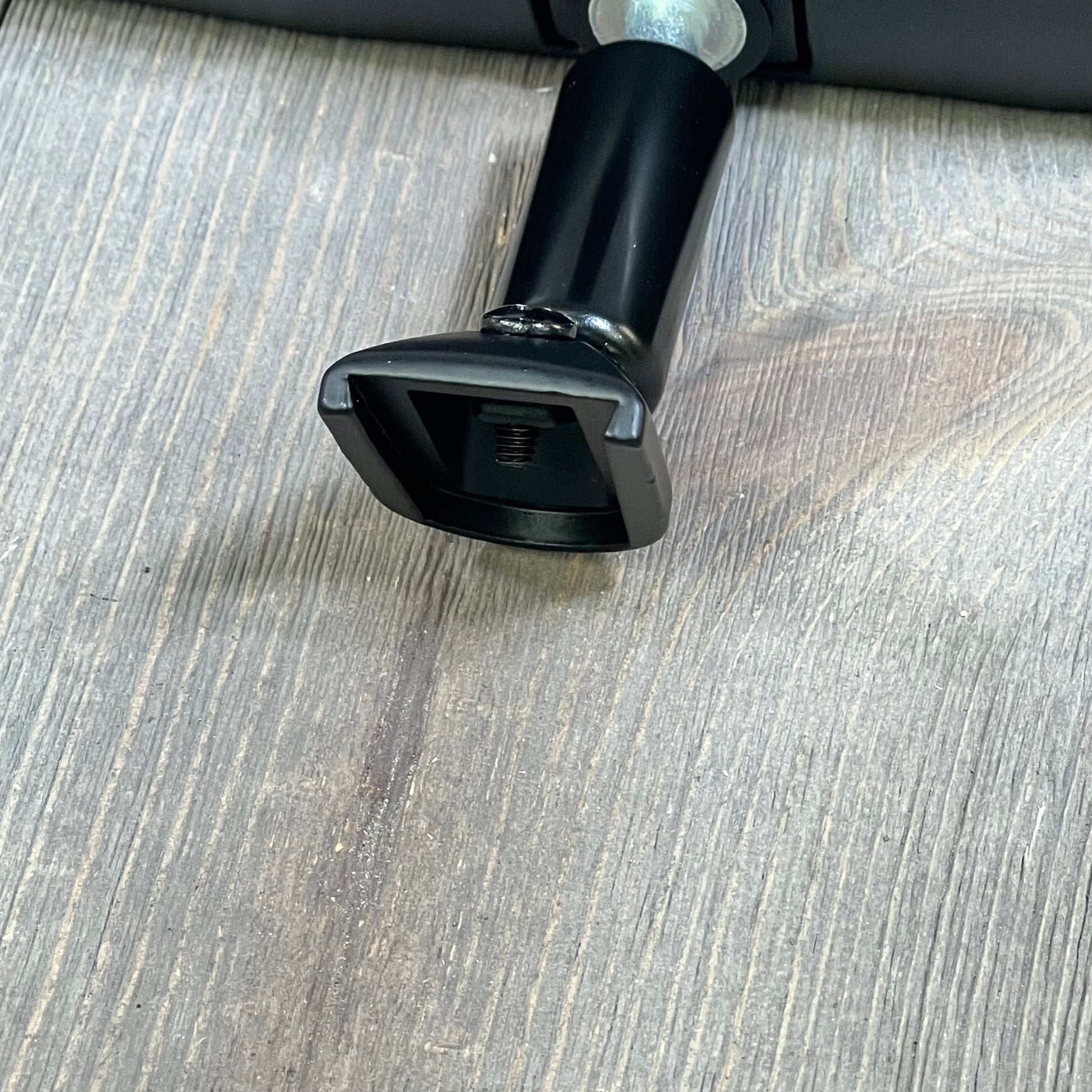Mazda OEM rearview mirror mount, close-up view showing base and attachment point for Mazda 3, CX-3, CX-5, MX-5.