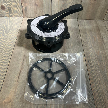 Black key cover and handle assembly with gasket and O-ring for Hayward SP0710 multiport valves on wood background.