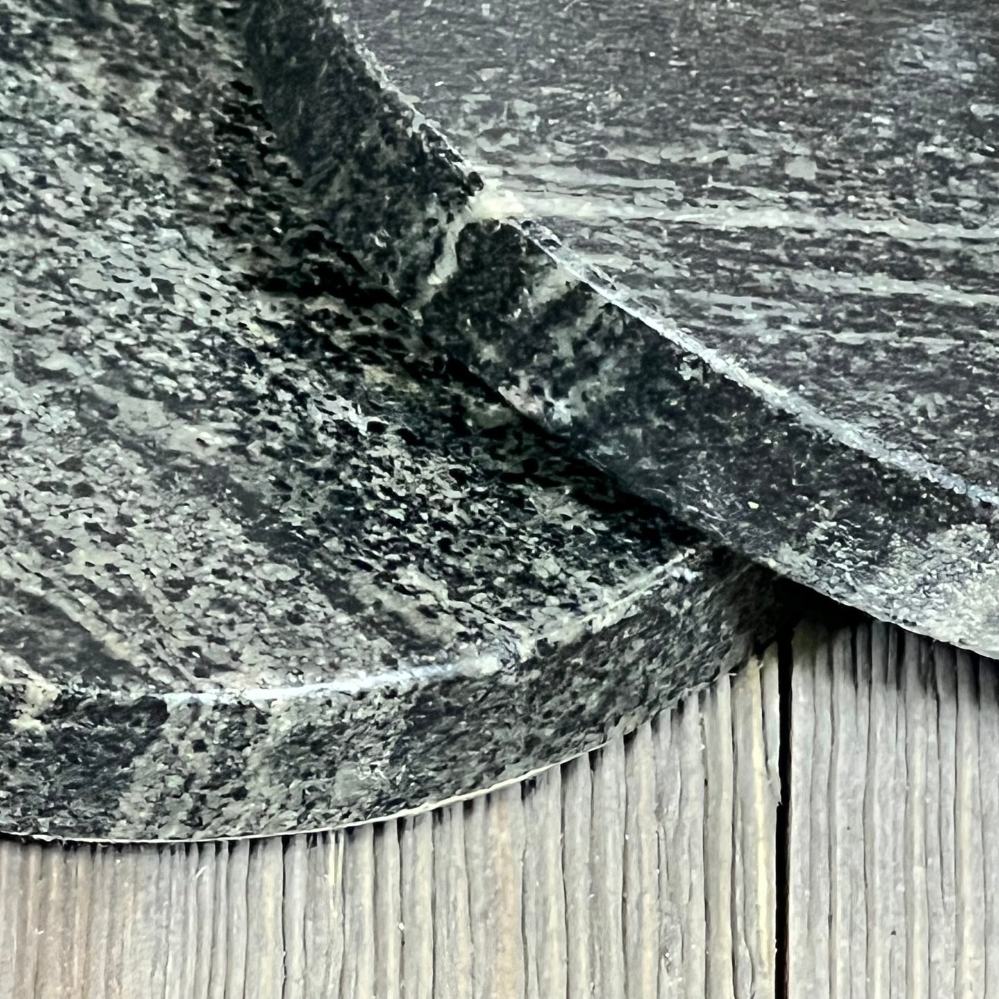 Elegant black marble coasters, 4-inch round, showcasing natural patterns and heat tolerance, perfect for stylish home decor.
