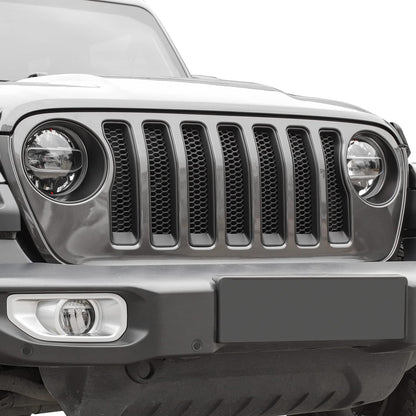 Matte black front grill inserts and headlight trim on Jeep Wrangler 2018-2023 JL, enhancing exterior style and protection.