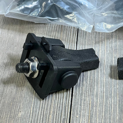Black Jeep TJ hood latch with textured grip, factory style catch kit part for 1997-2006 Wrangler on wood surface.