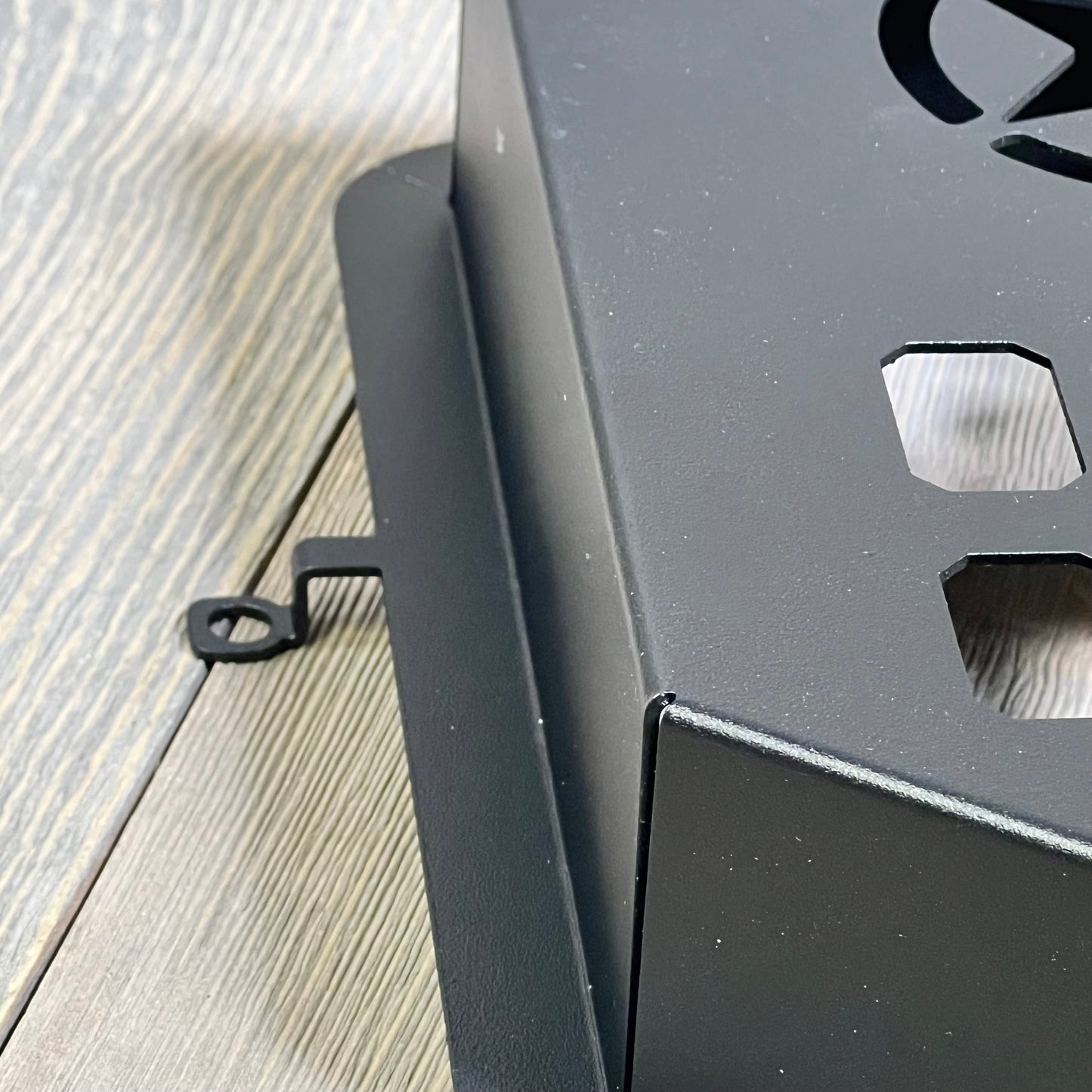 Black metal storage pocket organizer close-up, designed for 2011-2018 Jeep Wrangler JK JKU, featuring a star cutout.