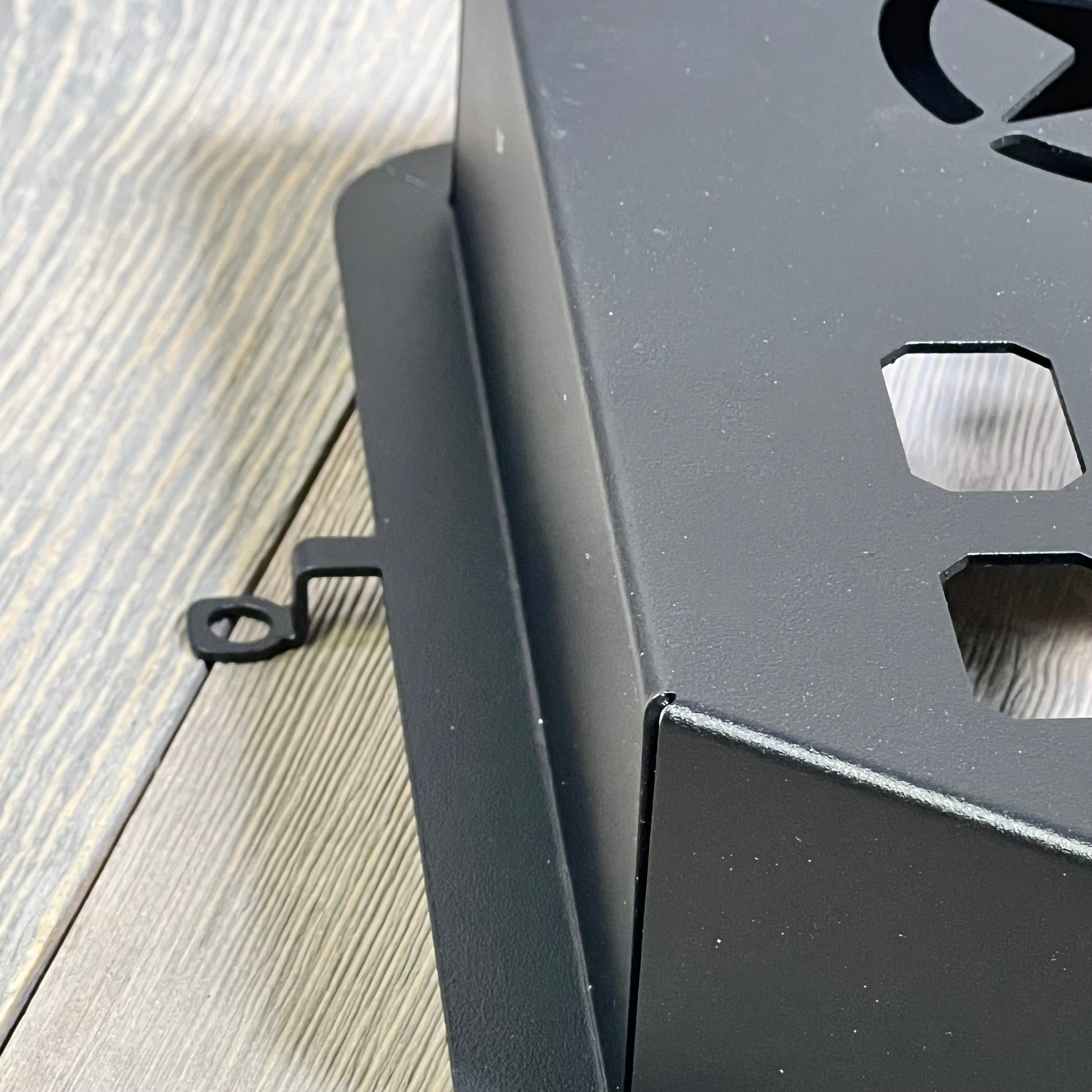 Black metal storage pocket organizer close-up, designed for 2011-2018 Jeep Wrangler JK JKU, featuring a star cutout.