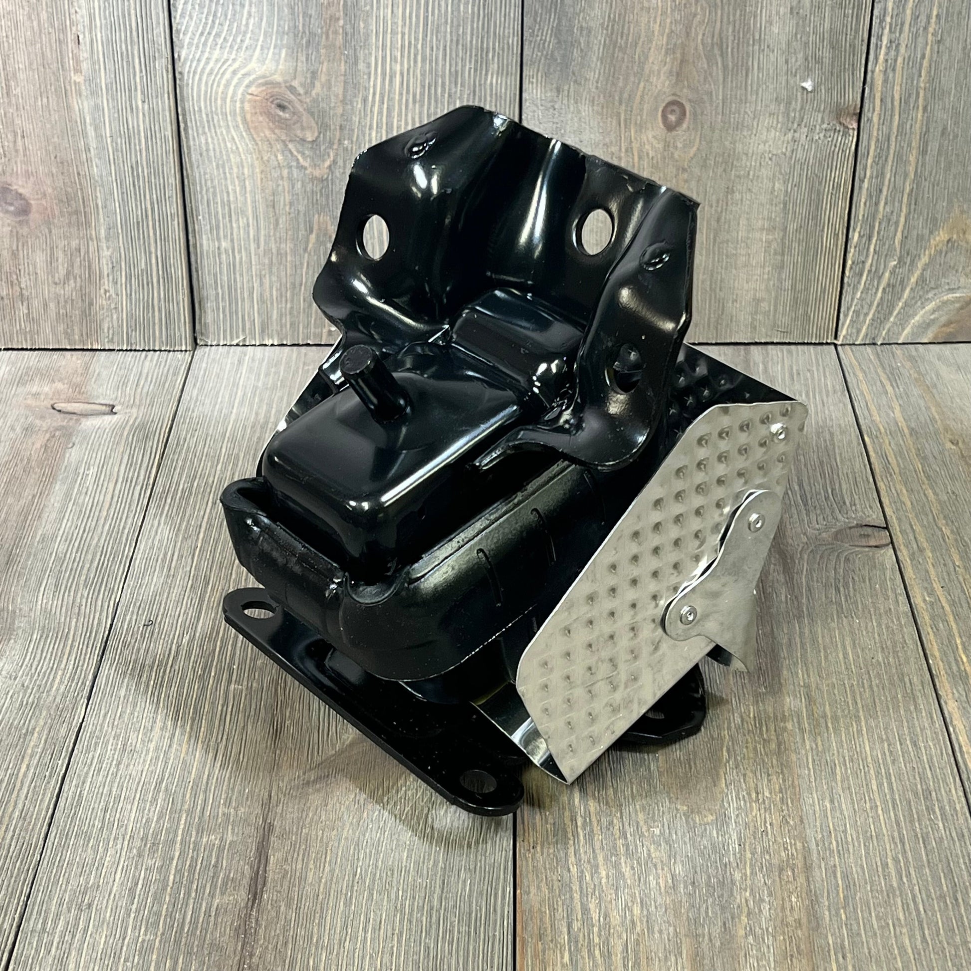 Engine motor mount for 2007-2014 Tahoe and Silverado, durable black metal with silver detailing, right or left fit.