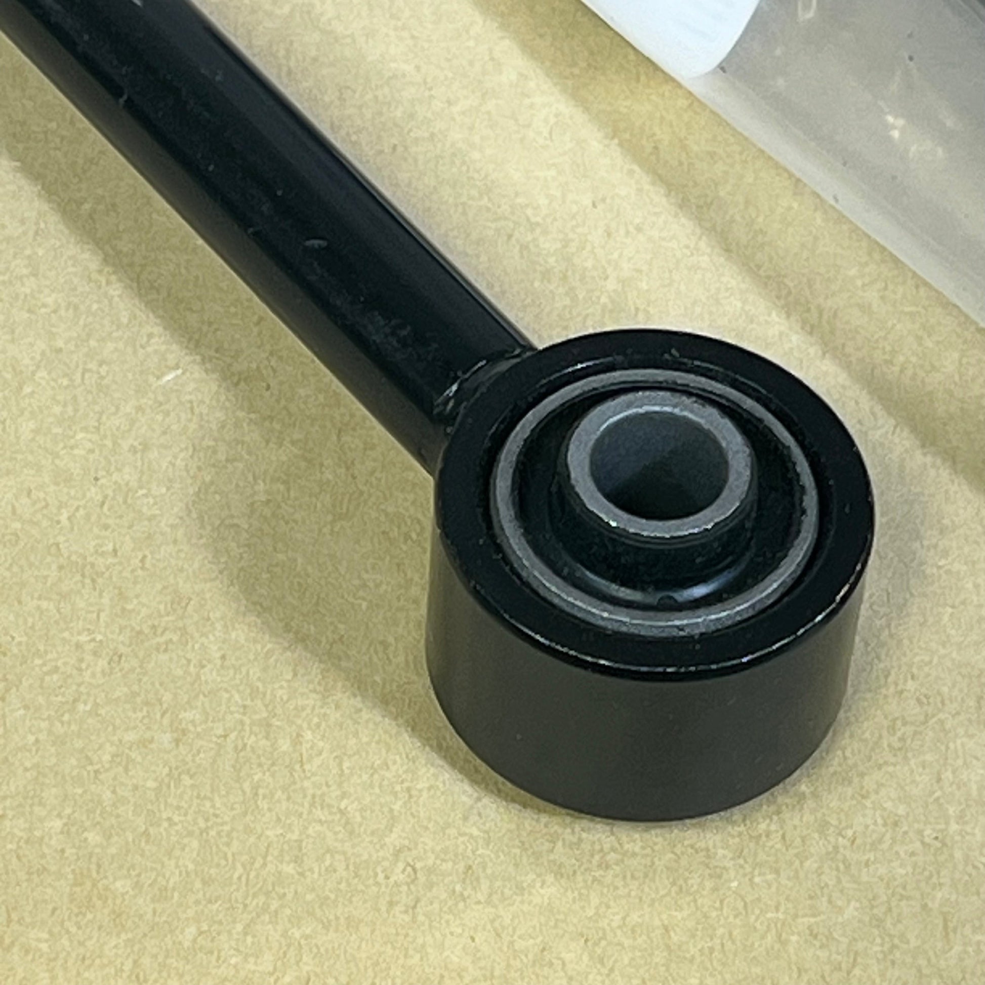 Sturdy black cciyu front stabilizer end link for 2000-2005 Ford Excursion, F-250, F-350 Super Duty 2WD suspension.