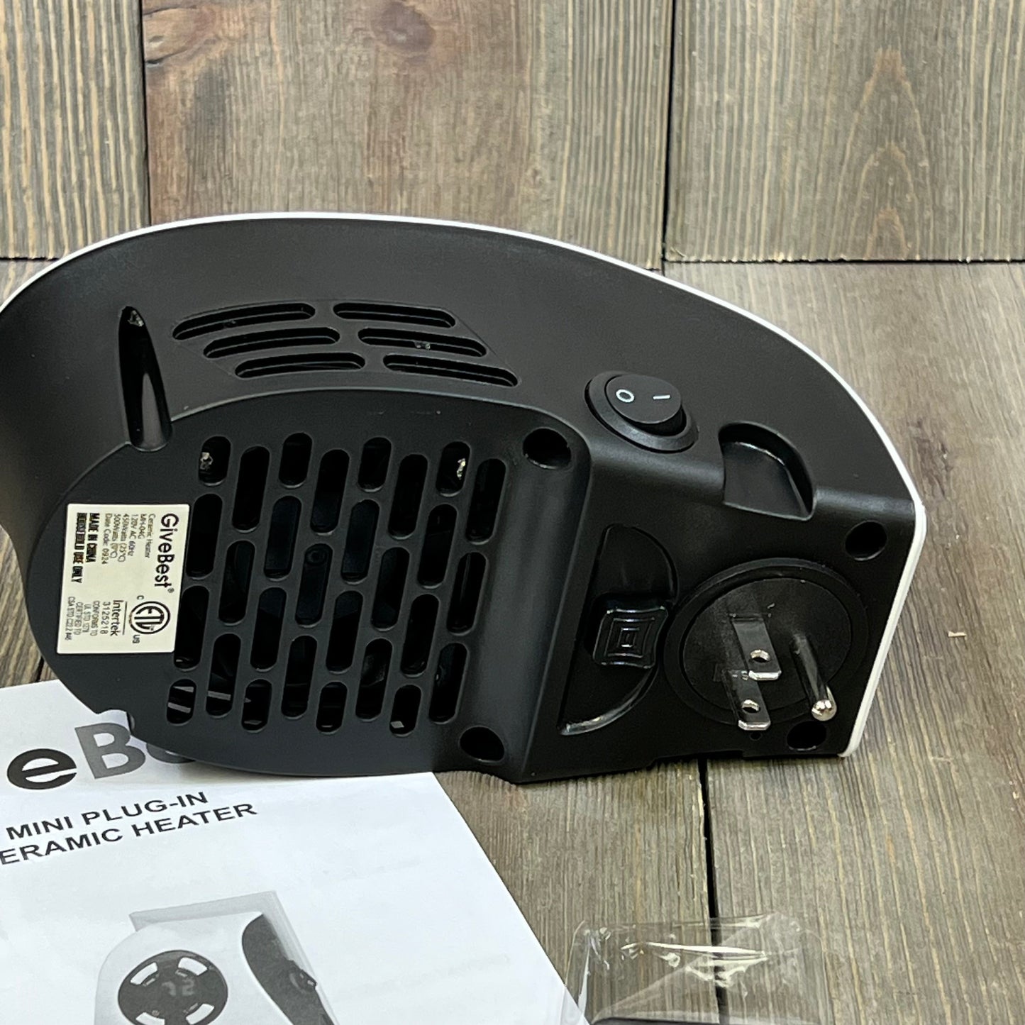GiveBest space heater base view showing plug-in design and safety switch, ideal for home and office use.