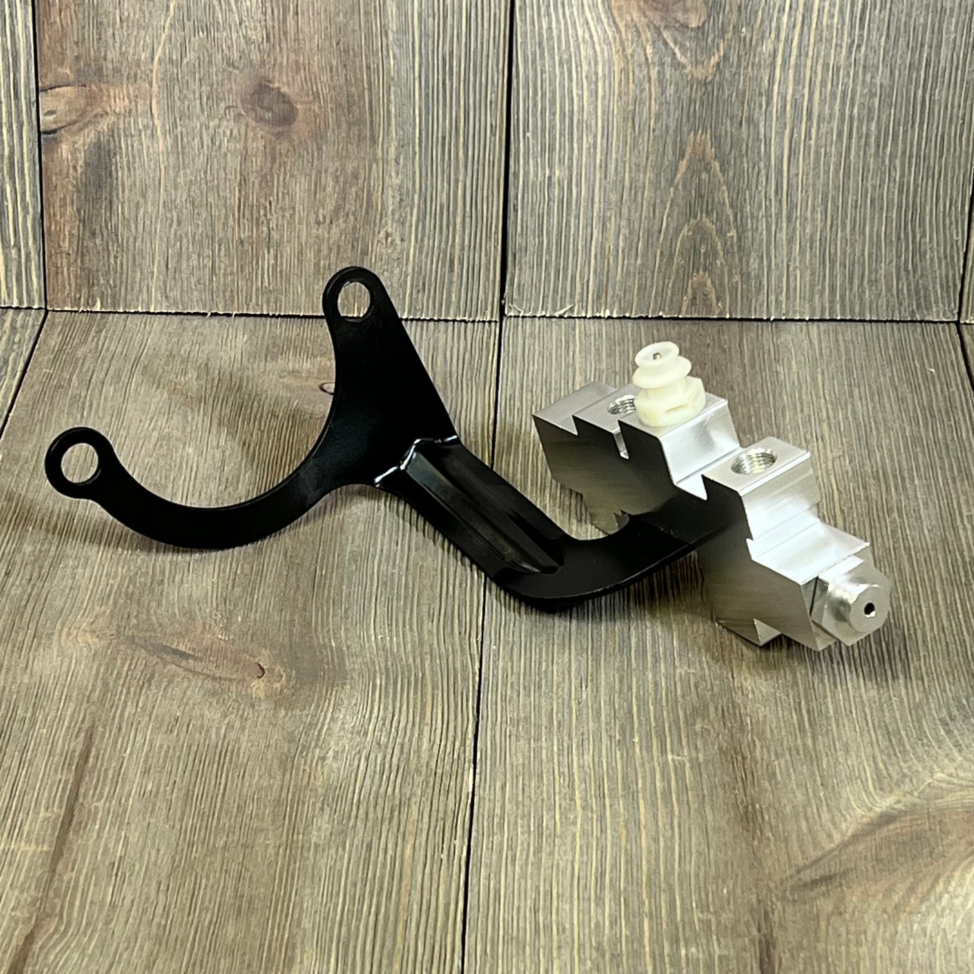 Brake proportioning valve replacement for GM Chevy Truck C/K 1500 2500 3500, 1989-1994, on wooden background.