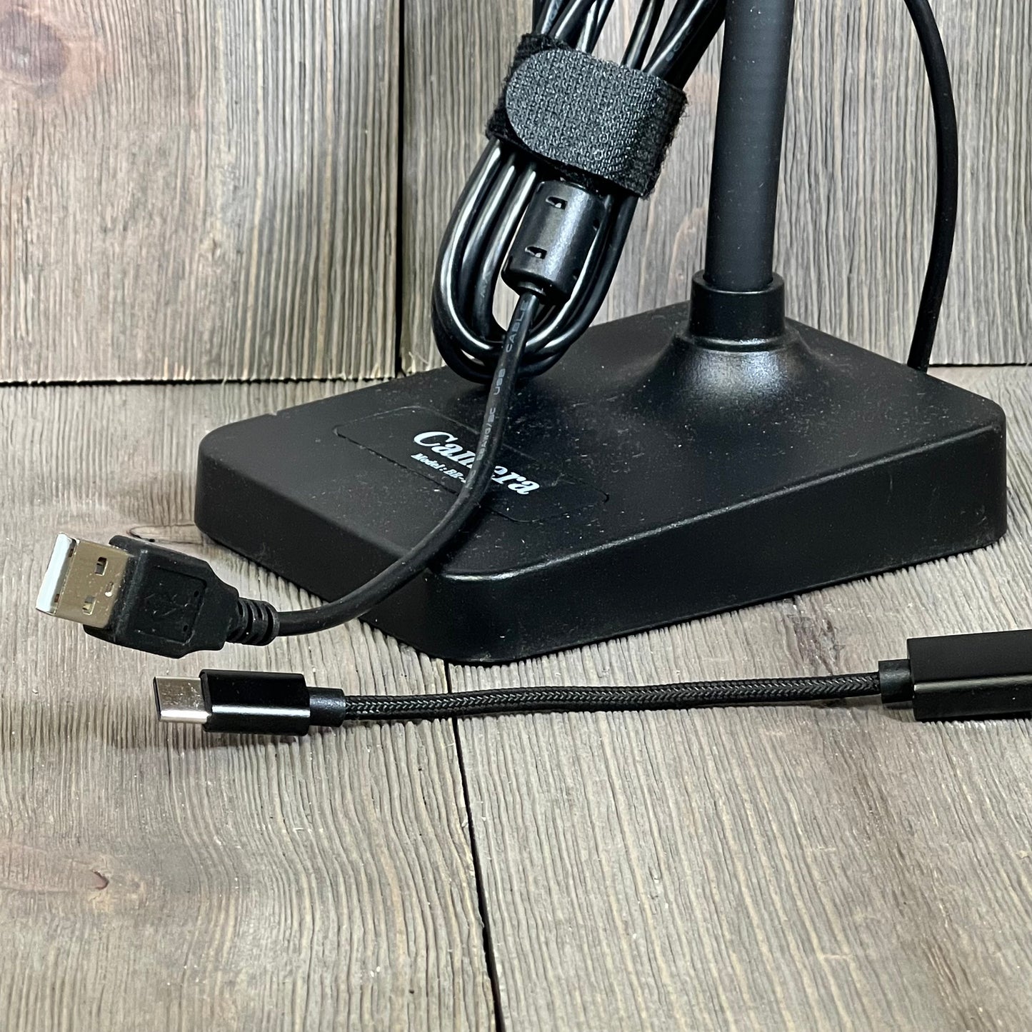USB document camera base with attached cables for seamless connection to Mac OS, Windows, and Chromebook devices.