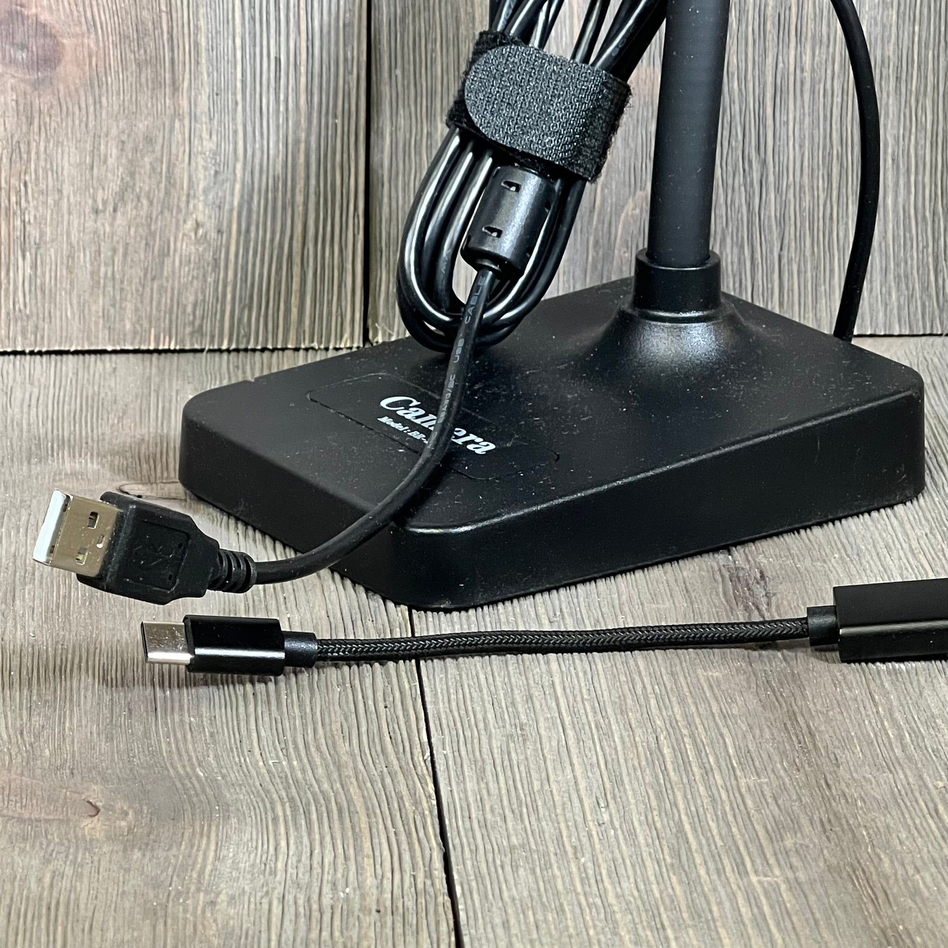 USB document camera base with attached cables for seamless connection to Mac OS, Windows, and Chromebook devices.