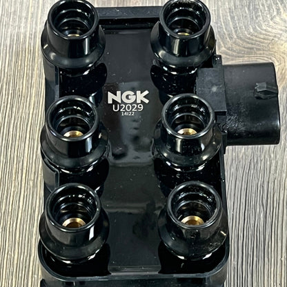 NGK U2029 Ignition Coil for Distributorless Ignition System, featuring sleek black design and durable connectors.