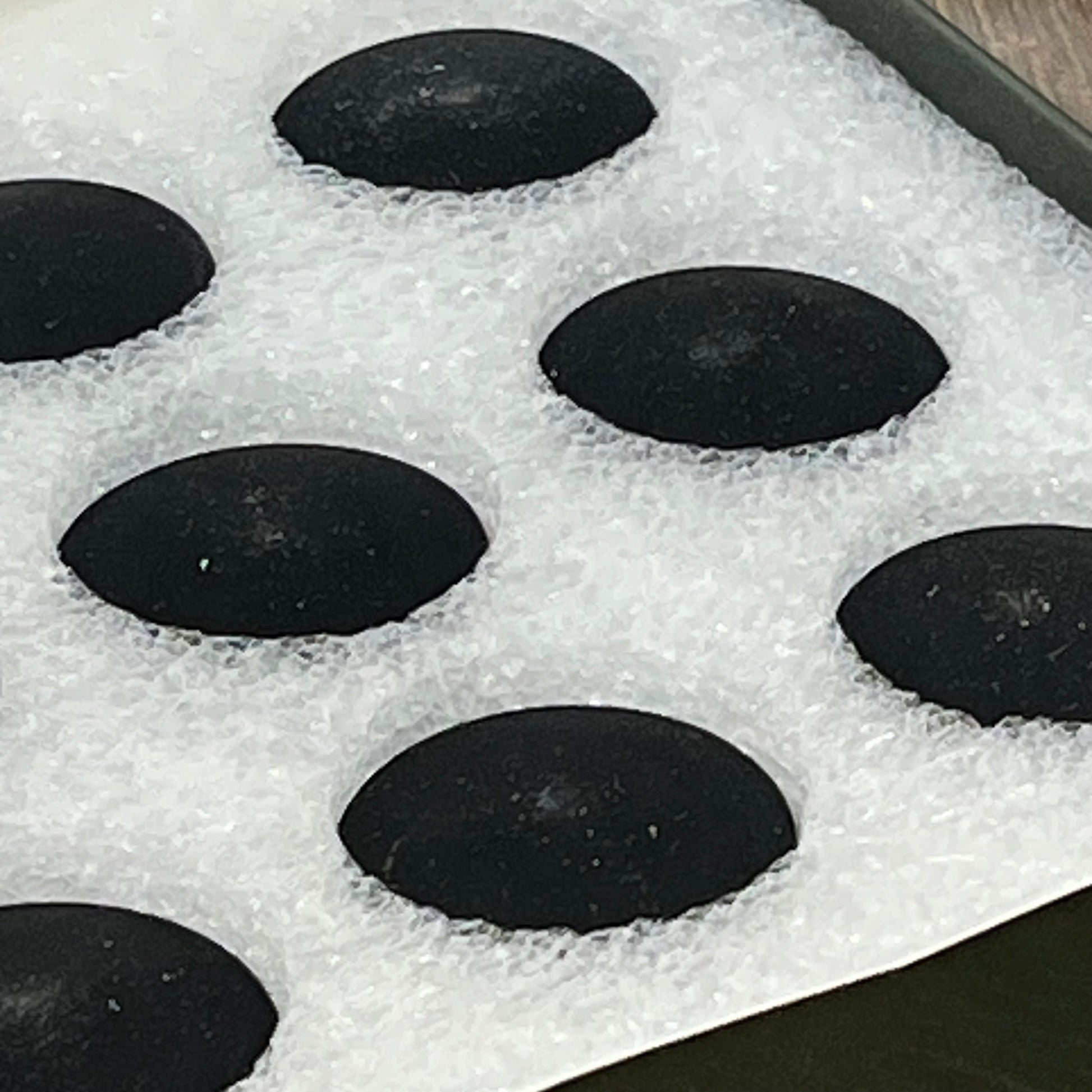Black magnetic silicone curtain weights in protective packaging, ideal for bathroom decor, liners, and outdoor use.