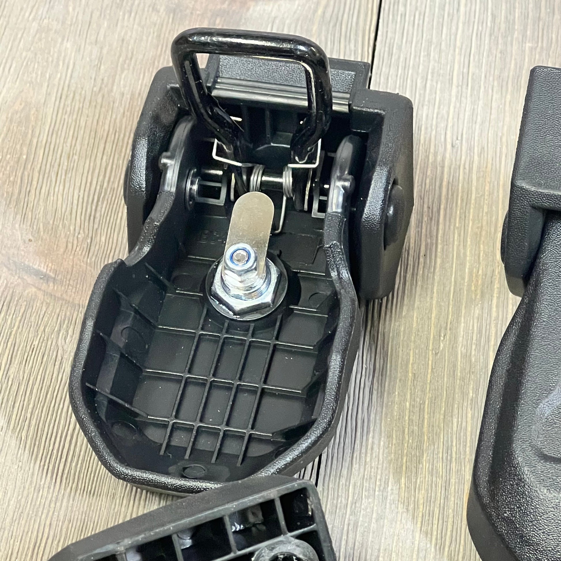 Black OEM hood latch for Jeep Wrangler JL, showcasing locking mechanism with key feature, ideal for 2018-2024 models.