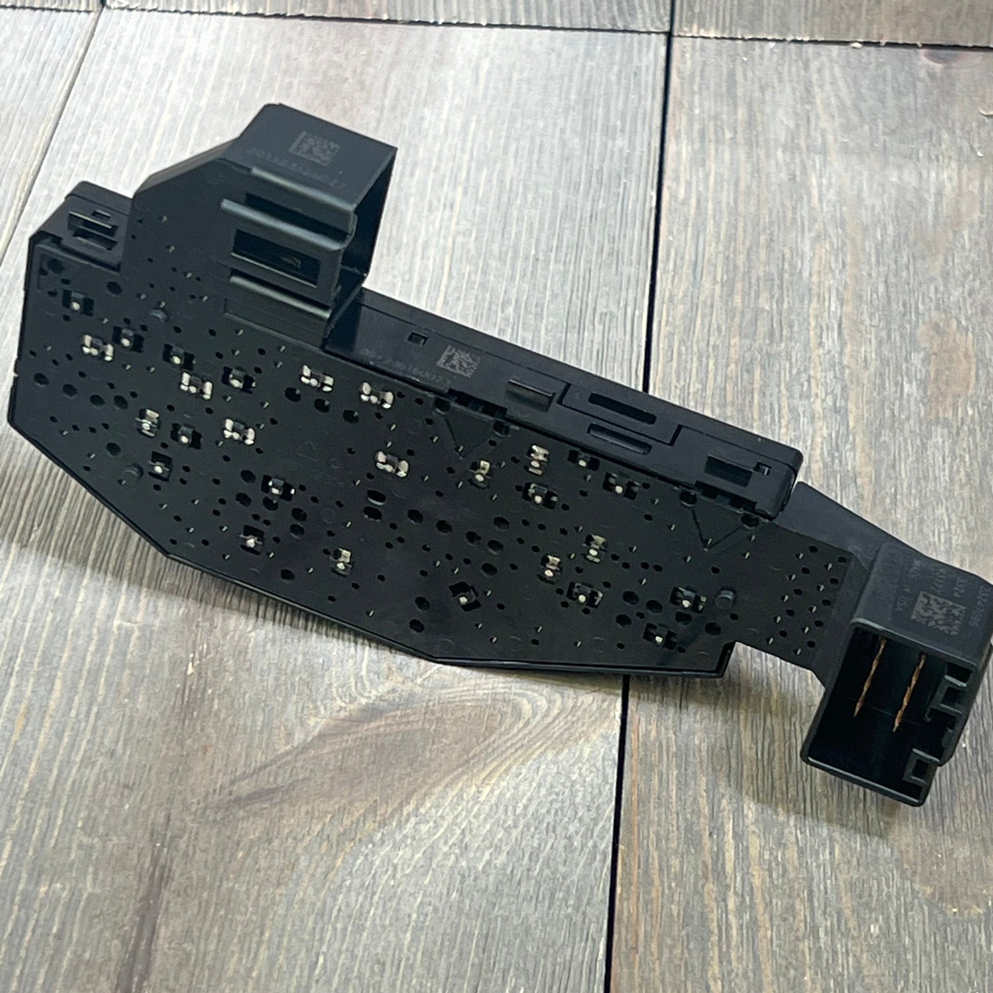 Front passenger seat control switch for Chevy, GMC, Cadillac, OE# 20914737, shown on wood surface.