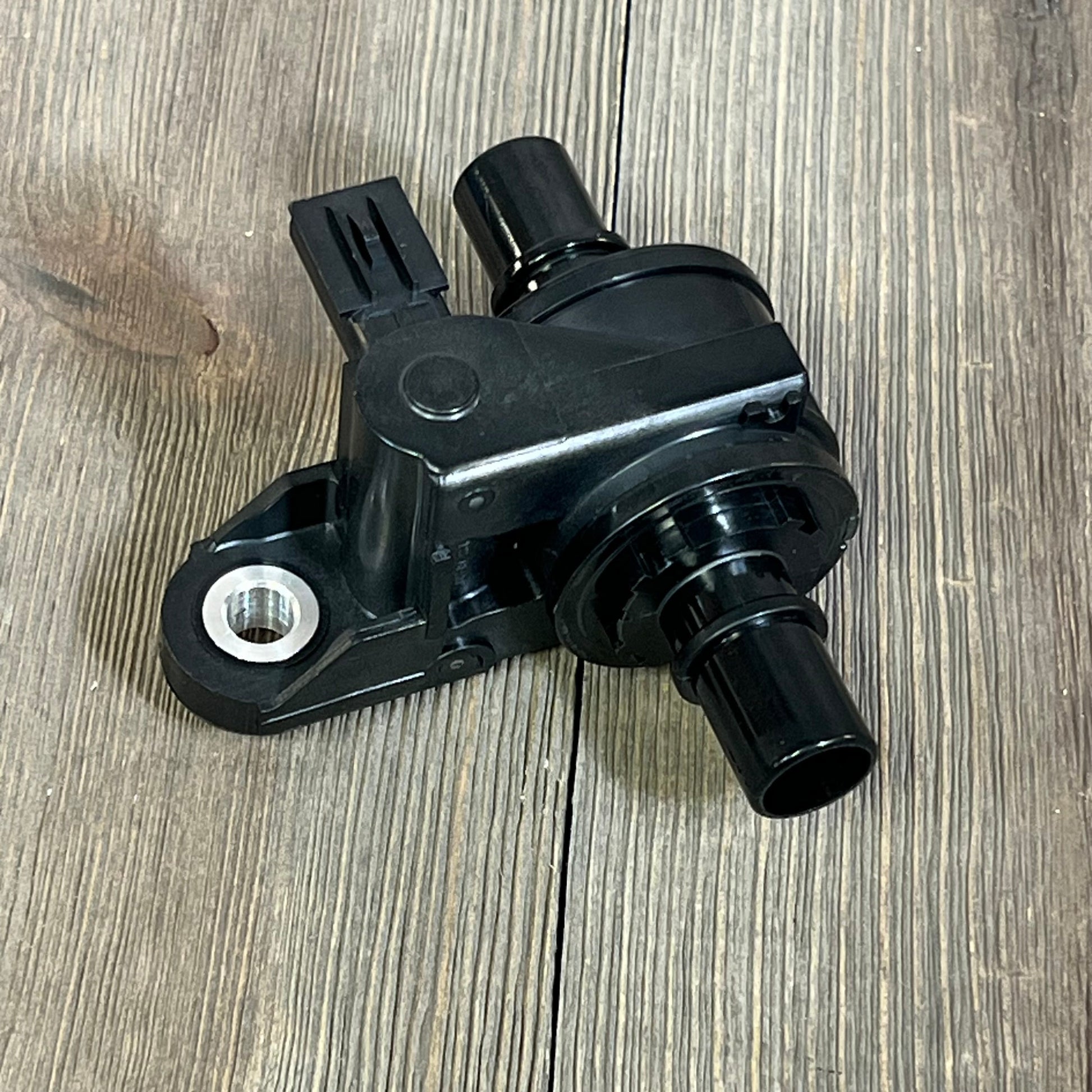 NOVAPARTS Coolant Water Control Valve for Toyota Corolla and Lexus UX200, shown on wooden surface.