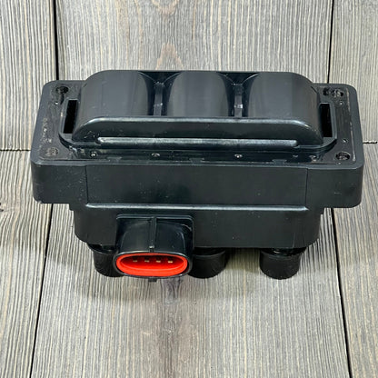 Black NGK U2029 (48806) ignition coil for distributorless systems, showcasing durable design and red connector.