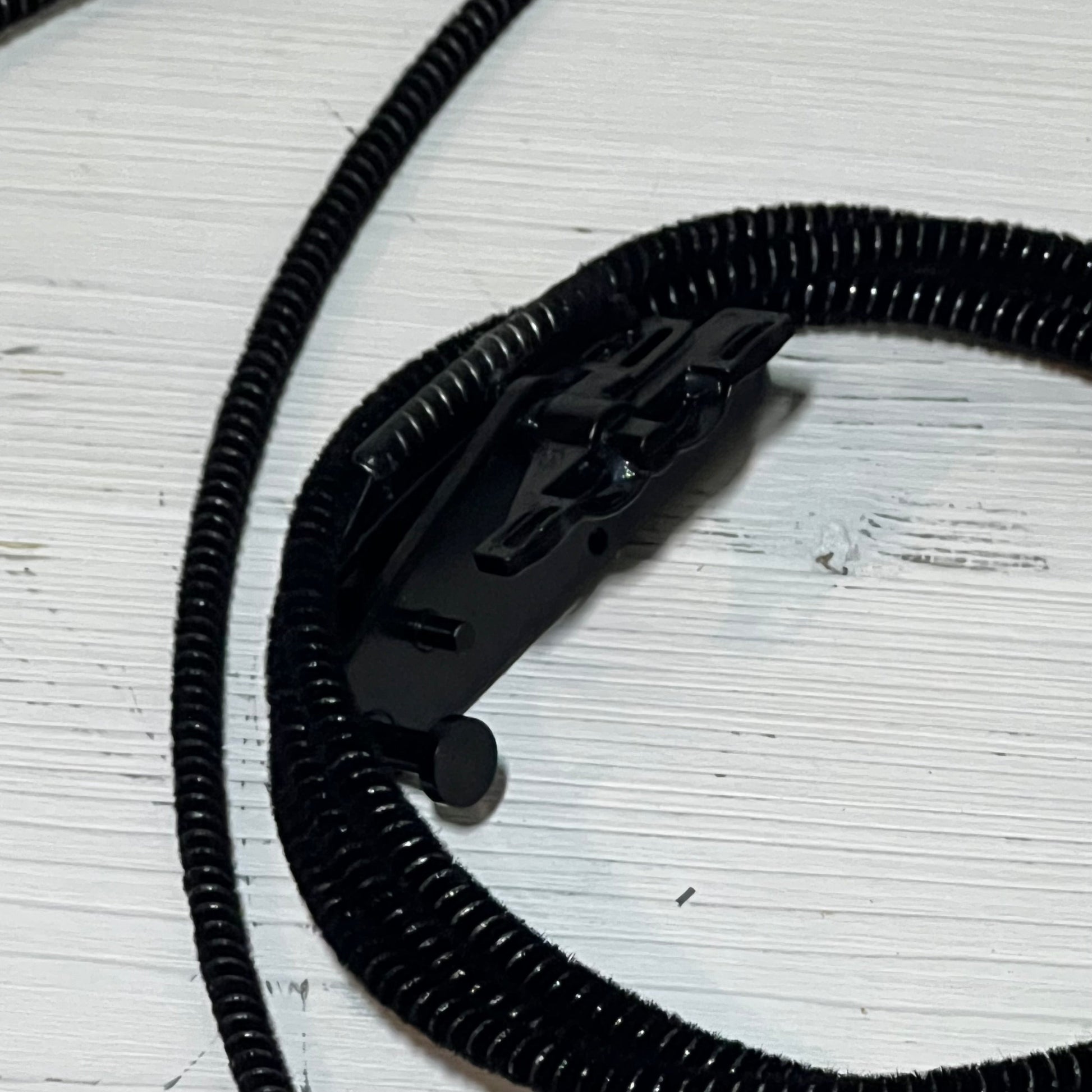 Black sunroof glass cable for Ford F150, F250, F350, F450 models, 2015-2020, with durable black coil design.