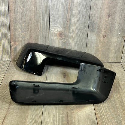 Glossy black mirror cover cap trim for 2019-2024 Chevy Silverado 1500 and GMC Sierra 1500, displayed on wood background.