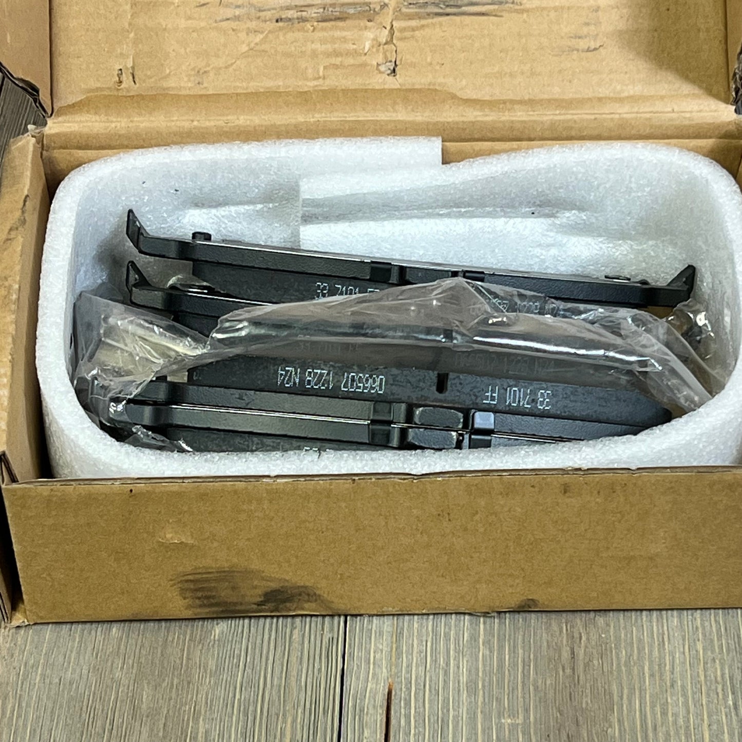 ECCPP rear ceramic brake pads kit in protective packaging, ideal for Cadillac, Chevrolet, GMC. QuietCast premium quality.